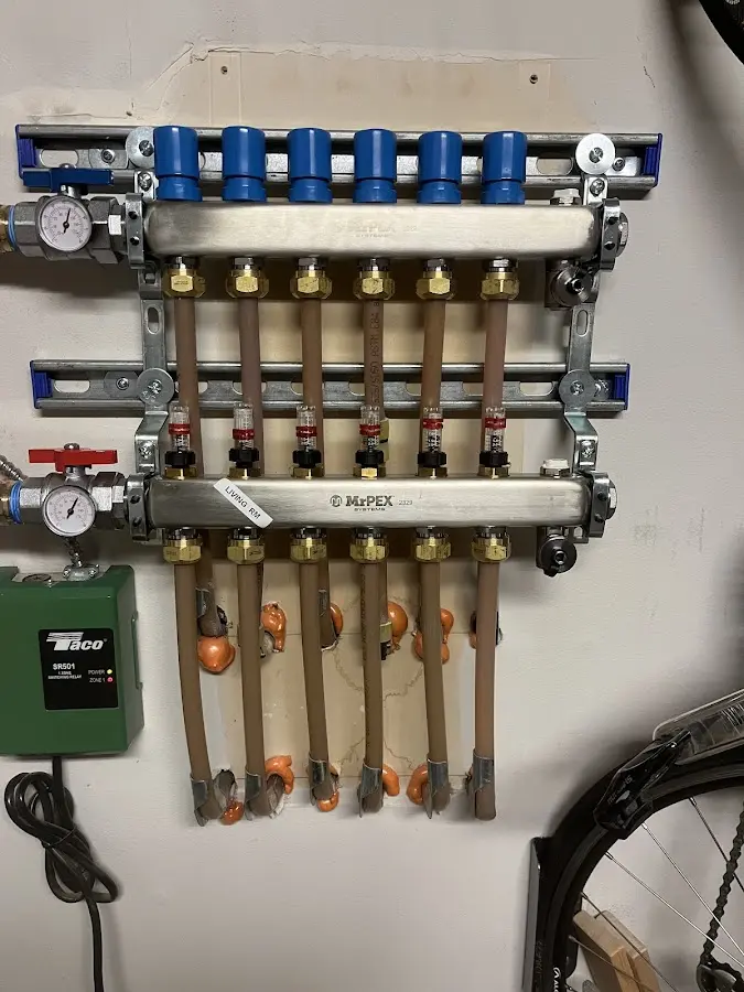 Plumber performing Water Heater Repair at a residential property in Long Hill